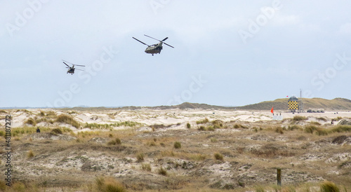 Chinook helicopters flying over the beach