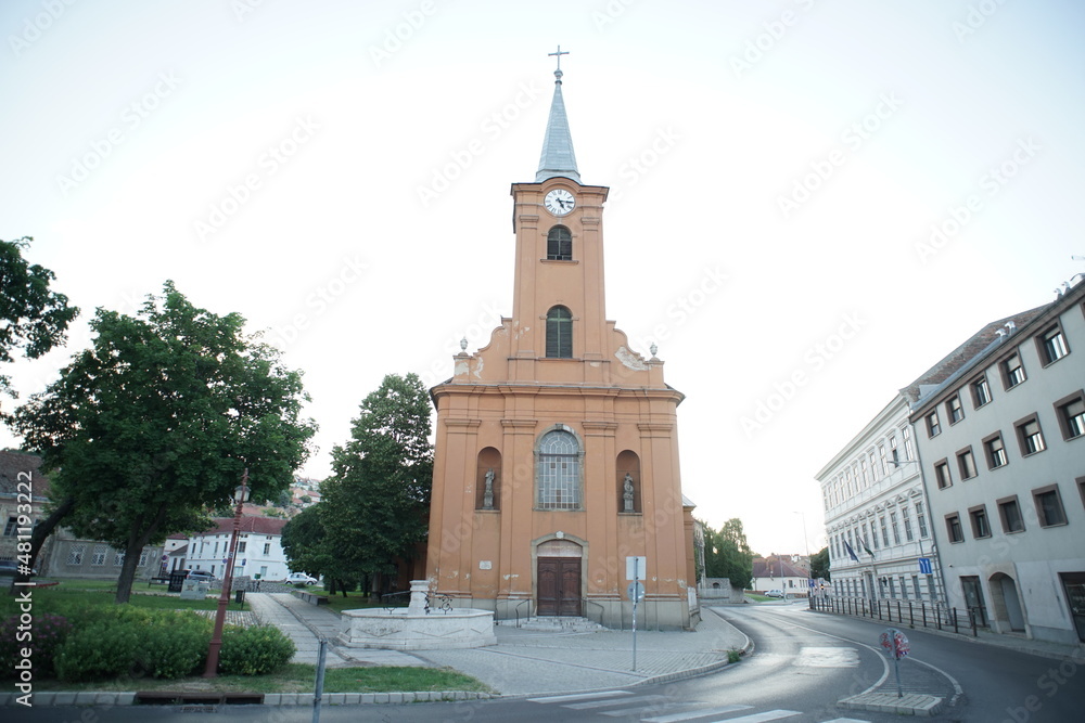 Church facade in a small city Europe Christian cross