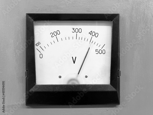 The voltmeter is designed to measure the voltage in an electrical circuit. Black and white photo photo