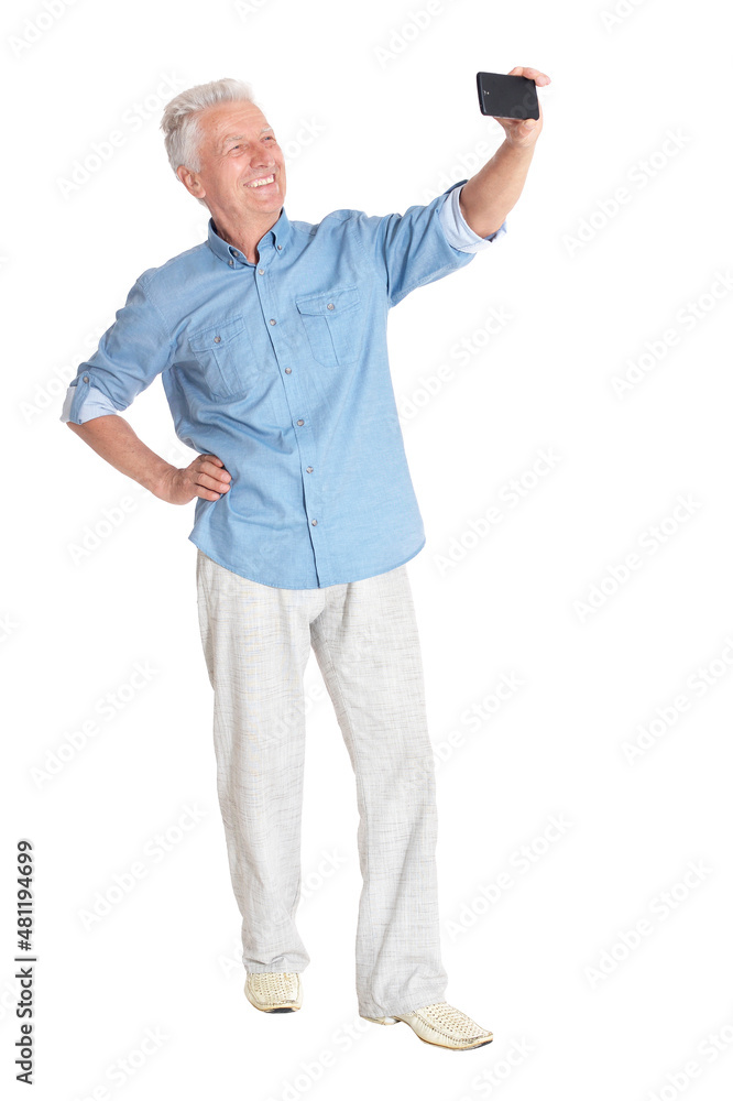 senior man taking selfie on white background senior man taking selfie on white background
