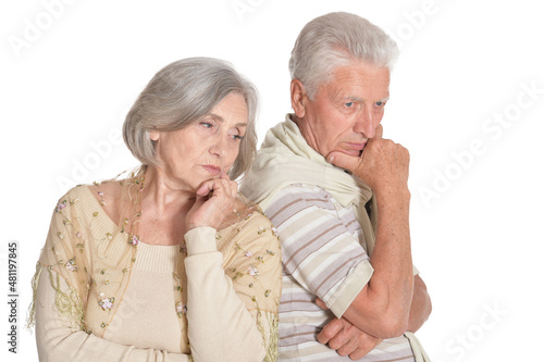 Portrait of sad senior couple on white background