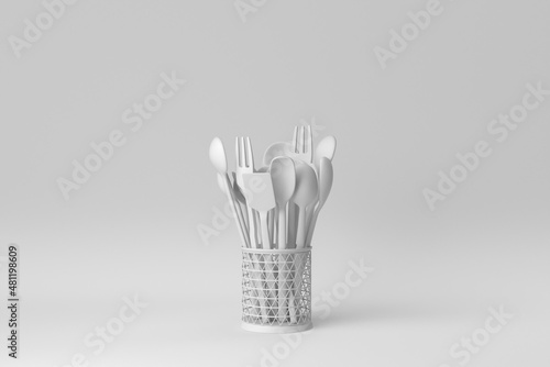 Fototapeta Stainless steel cutlery Holder with wooden spoons and forks on white background