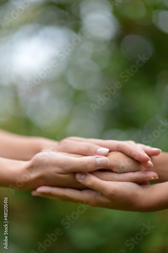 granddaughter and grandmother holding hands © aletia2011