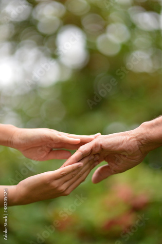 granddaughter and grandmother holding hands © aletia2011