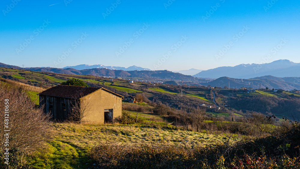 countryside at sunset with barn and mountains in the background, Gesualdo, Taurasi, Avellino, Campania, Italy