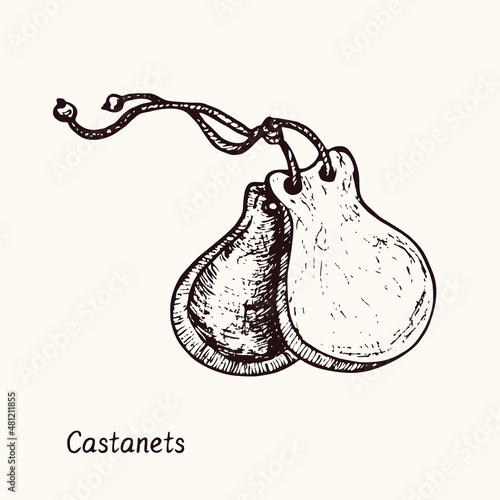 Castanets. Ink black and white doodle drawing in woodcut style with inscription.