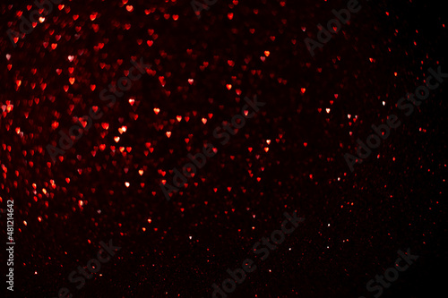 Fototapeta Red hearts, sparkling glitter bokeh background, valentines day abstract defocuse