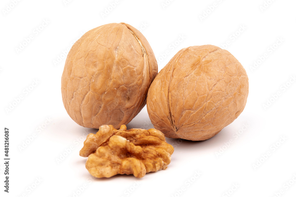 Walnuts in shells isolated on white background. Package design element with clipping path. Walnuts in shells isolated on white background. Package design element with clipping path.