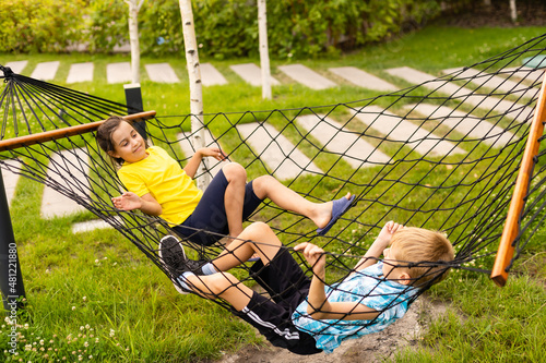 children in a hammock. Happy family holiday.