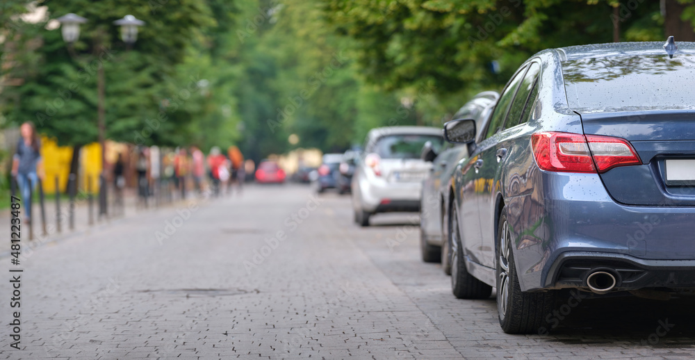Close up of a car parked illegally against traffic rules on pedestrian city street side Close up of a car parked illegally against traffic rules on pedestrian city street side