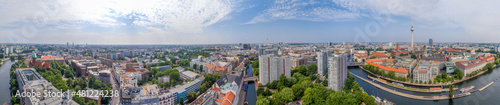 BERLIN  GERMANY - JULY 24  2016  Panoramic aerial view of Berlin skyline at sunset with major city landmarks along Spree river.