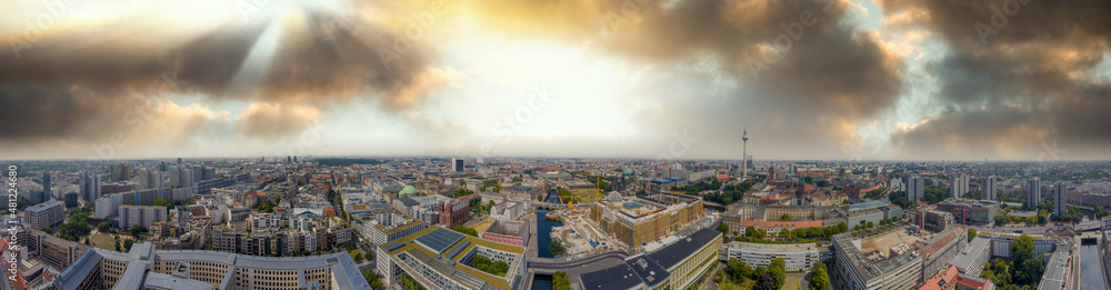 Obraz premium Panoramic aerial view of Berlin skyline at sunset with major city landmarks along Spree river, Germany from drone in summer season.