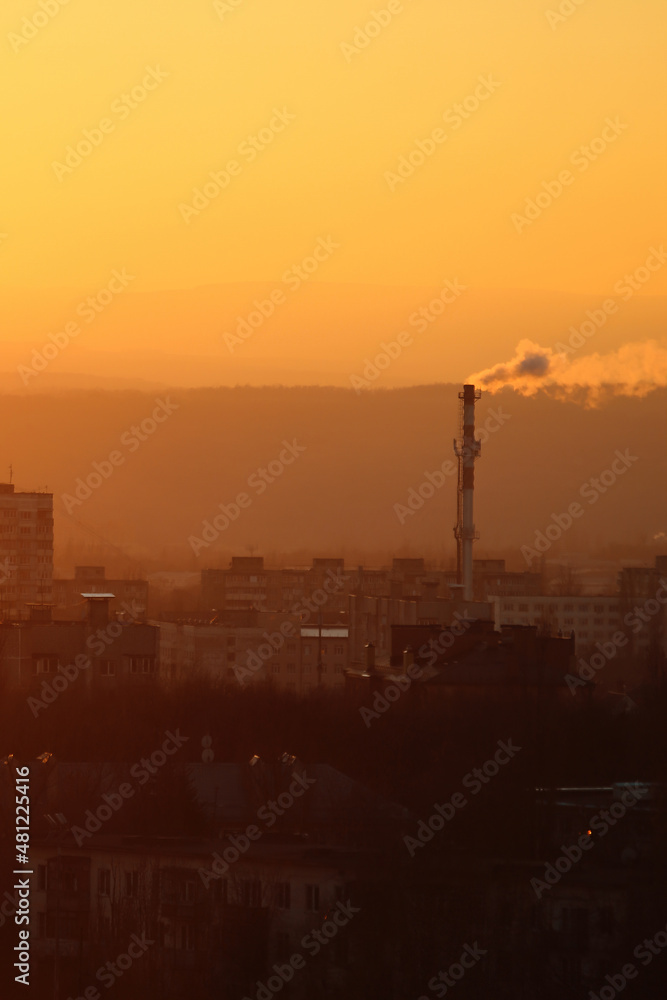 sunset over the industrial city