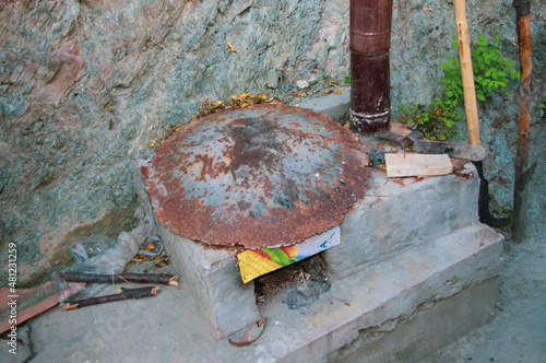 Traditional cooking plate in the village. Rural kitchen architecture, stove in open space. DIY concept.