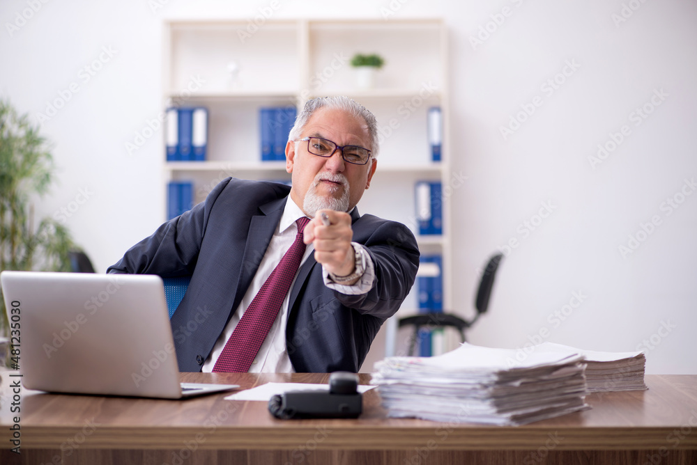 Old male employee and too much work in the office