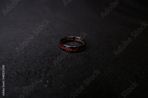 black ring on black background lord of the rings background texture of black fabric bijouterie