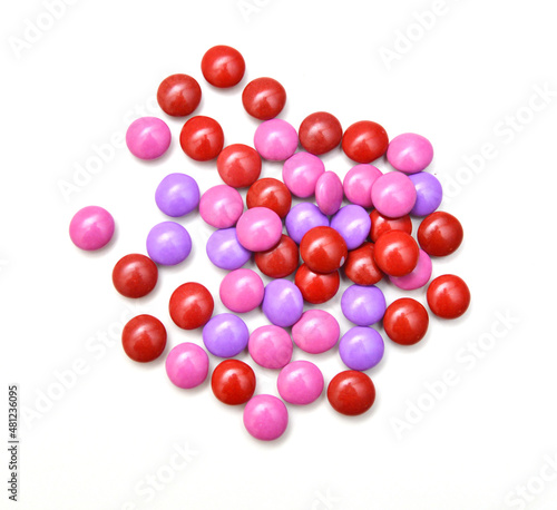 sugar coated pills on white background