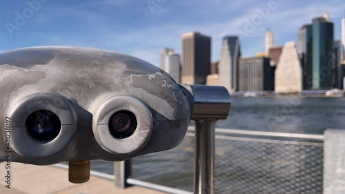 Binoculars, telescope on the embankment. Looking New York, downtown Manhattan.