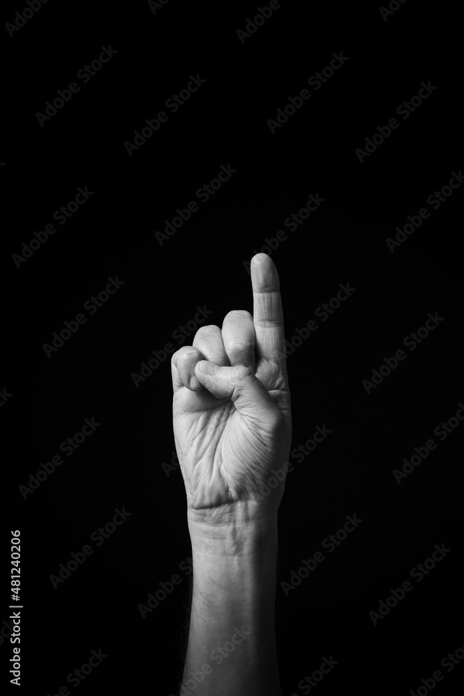 B+W image of hand demonstrating Chinese sign language letter I isolated against black background B+W image of hand demonstrating Chinese sign language letter I isolated against black background