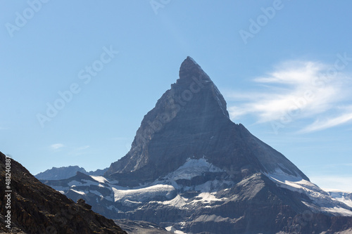 Matterhorn Mountain with white snow and blue sky in summer