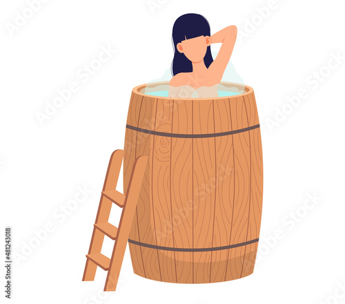 Lady standing in wooden tub with hot water. Home bathhose, wellness spa procedures in wooden water barrel. Cleansing skin and hair concept. Female character is relaxing in home sauna with steam