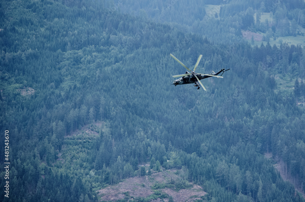the helicopter flies over the forest the helicopter flies over the forest