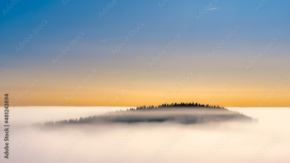 The floating hill above cotton clouds painted by sunrise
