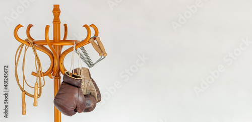 A retro sports equipment hanging on a coat hook.