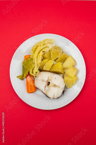 boiled fish with boiled potato, carrot and cabbage