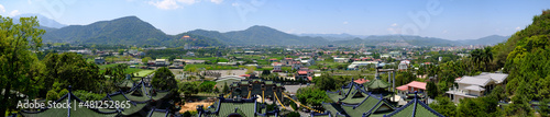 A panoramic view of many hills and temples in the town of Puli in Taiwan © Harrison