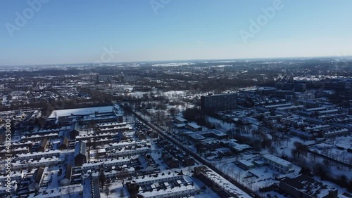 Winter aerial view of a snow covered residential Holland
