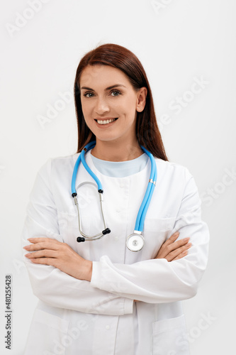 Doctor occupation. Experienced female general practitioner wearing a medical uniform  portrait