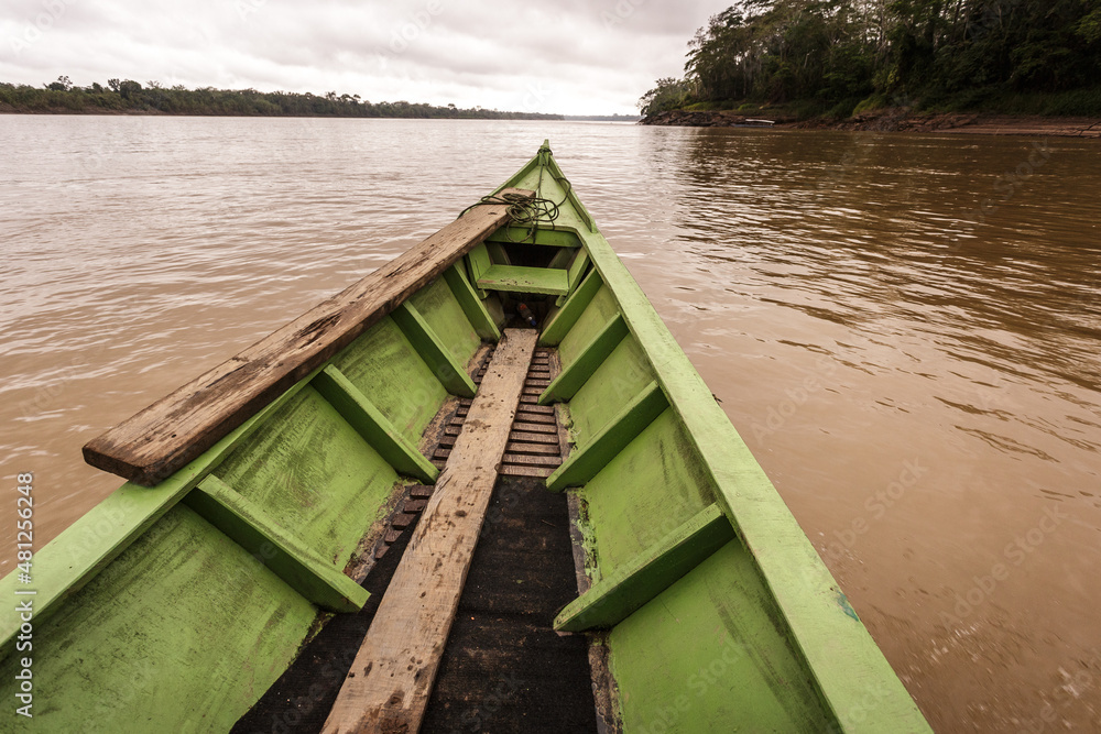 Naklejka premium The bow of a boat while sailing on an Amazonian river