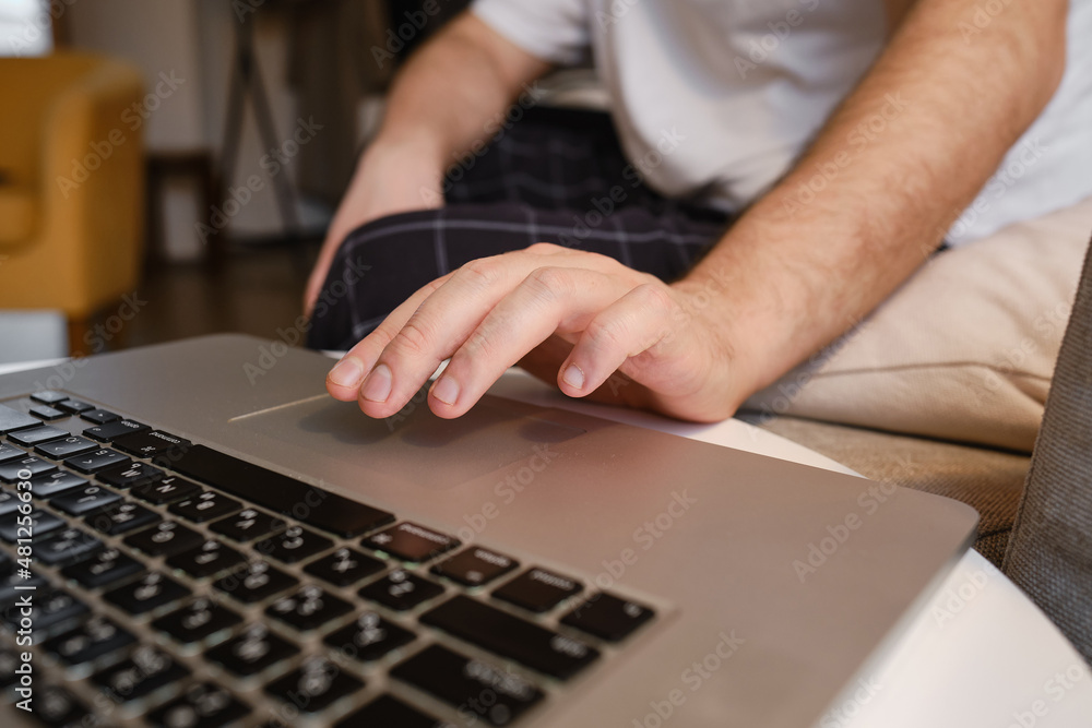 A man works at a laptop at the table. Remote work from home. Businessman at work in the office. Business background. Home office
A man works at a laptop at the table. Remote work from home. Businessman at work in the office. Business background. Home office