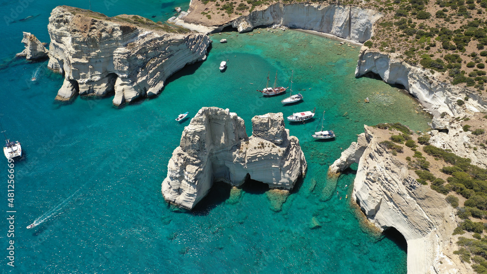 Aerial drone photo of Kleftiko a beautiful scenic white volcanic rock formation bay visited by sail boats and yachts with turquoise crystal clear sea and caves, Sea Meteora of Greece, Milos island