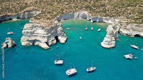 Aerial drone photo of Kleftiko a beautiful scenic white volcanic rock formation bay visited by sail boats and yachts with turquoise crystal clear sea and caves, Sea Meteora of Greece, Milos island