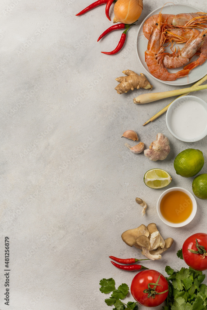 Fresh beautiful ingredients for delicious tom yum soup on a light background
