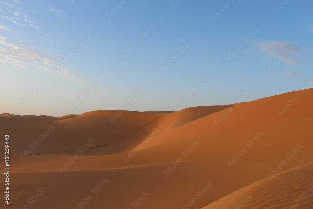 sand dunes in the desert at sunset