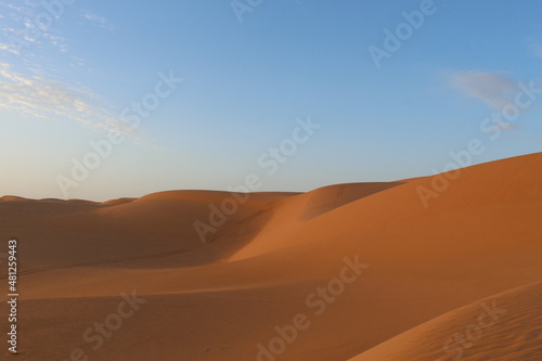 sand dunes in the desert at sunset © AHMED