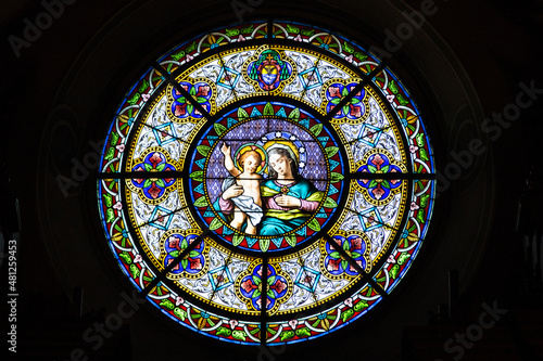 Obraz na płótnie The famsous Cathedral of Saint Lawrence in Lugano and its stained glass rosette of Virgin Mary with baby Jesus, Lugano, Switzerland w salonie