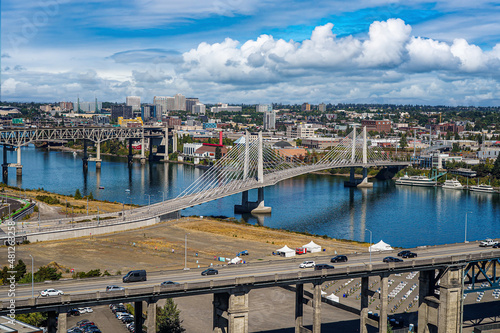 An aerial view of the Tilikum Cable-stayed bridge in downtown Portland, Oregon.  It is used for bicycles, walking, light rail and bus traffic.