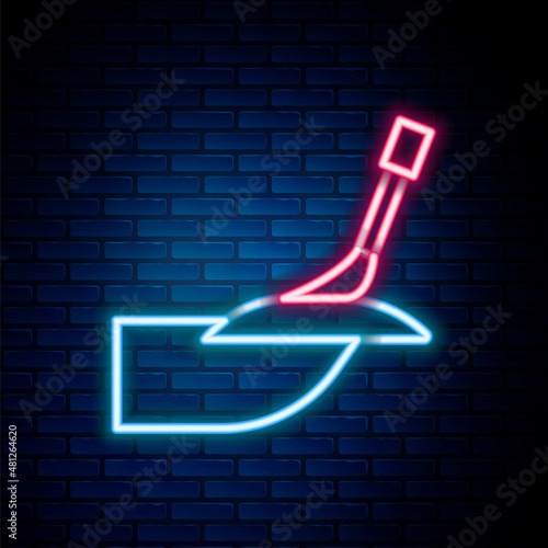 Glowing neon line Manicure icon isolated on brick wall background. Colorful outline concept. Vector