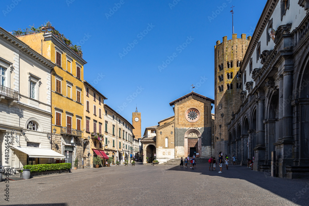 View of the square “Piazza della Repubblica” in Orvieto historic center with the church of S. Andrea and the town hall, Umbria, Italy