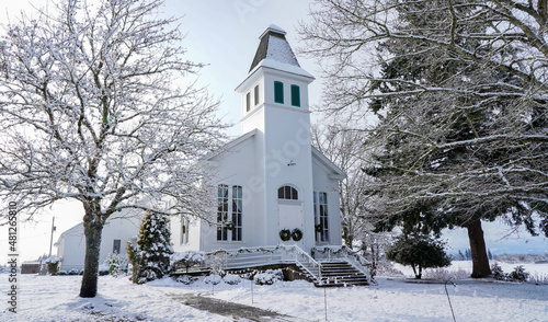 Snow covered historic Oakville Presbyterian Church in Oakville Oregon photo