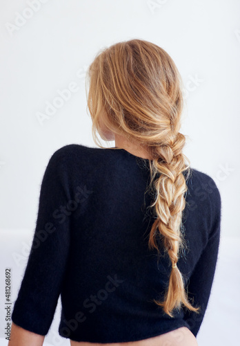 Back to the basics. Rearview shot of woman with a plaited hairstyle.