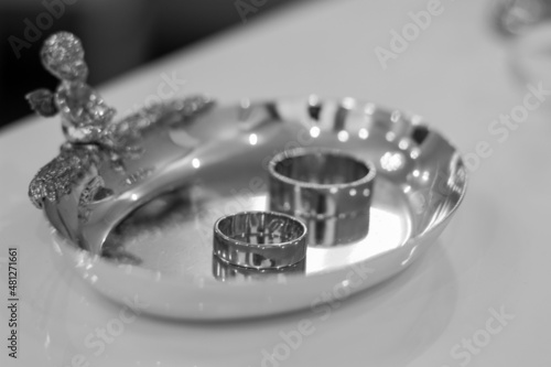rings for the bride and groom. wedding day. solemn day. black and white photo.
