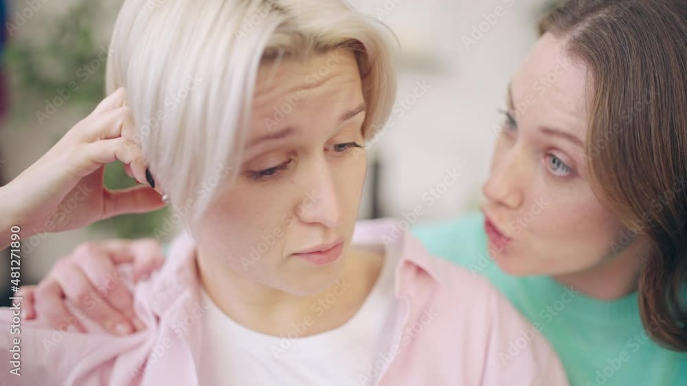 Young woman supporting female friend upset with relationship crisis problem Young woman supporting female friend upset with relationship crisis problem