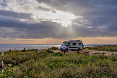Camper on the mediterranean coast. Mobile home travel and vacations