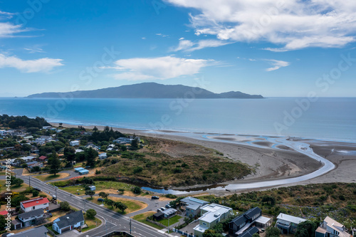 waikanae beach at Waimea Stream showing the stream mouth with Kapiti Island in the distance. this is a  village in the north island of New Zealand photo