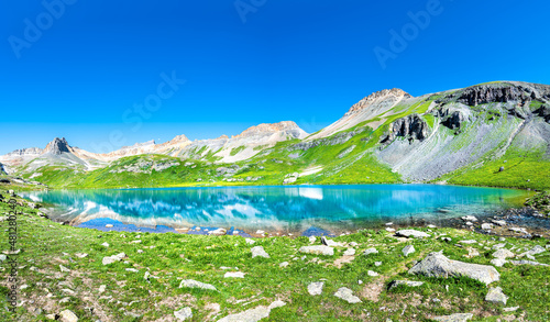 Fototapeta Naklejka Na Ścianę i Meble -  Panoramic view of beautiful Ice lake near Silverton, Colorado on rocky mountain peak and panorama reflection of summer landscape with nobody and green grass blue sky